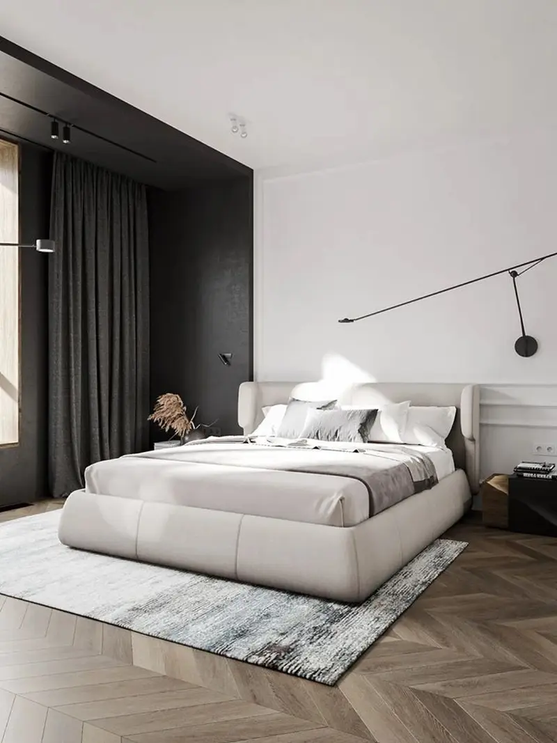 Темні штори з щільної тканини, що повністю закривають віконний отвір в акцентній чорній ніші світлої спальні